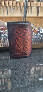 Mahogany and black roper wallet with hand cut basket pattern
